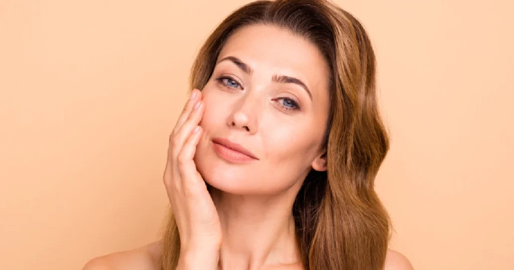 Smiling woman with clear, healthy skin, representing the results of The Art of Reversal in Yardley PA (2)