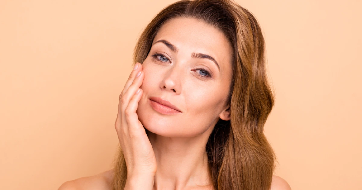 Smiling woman with clear, healthy skin, representing the results of The Art of Reversal in Yardley PA (2)